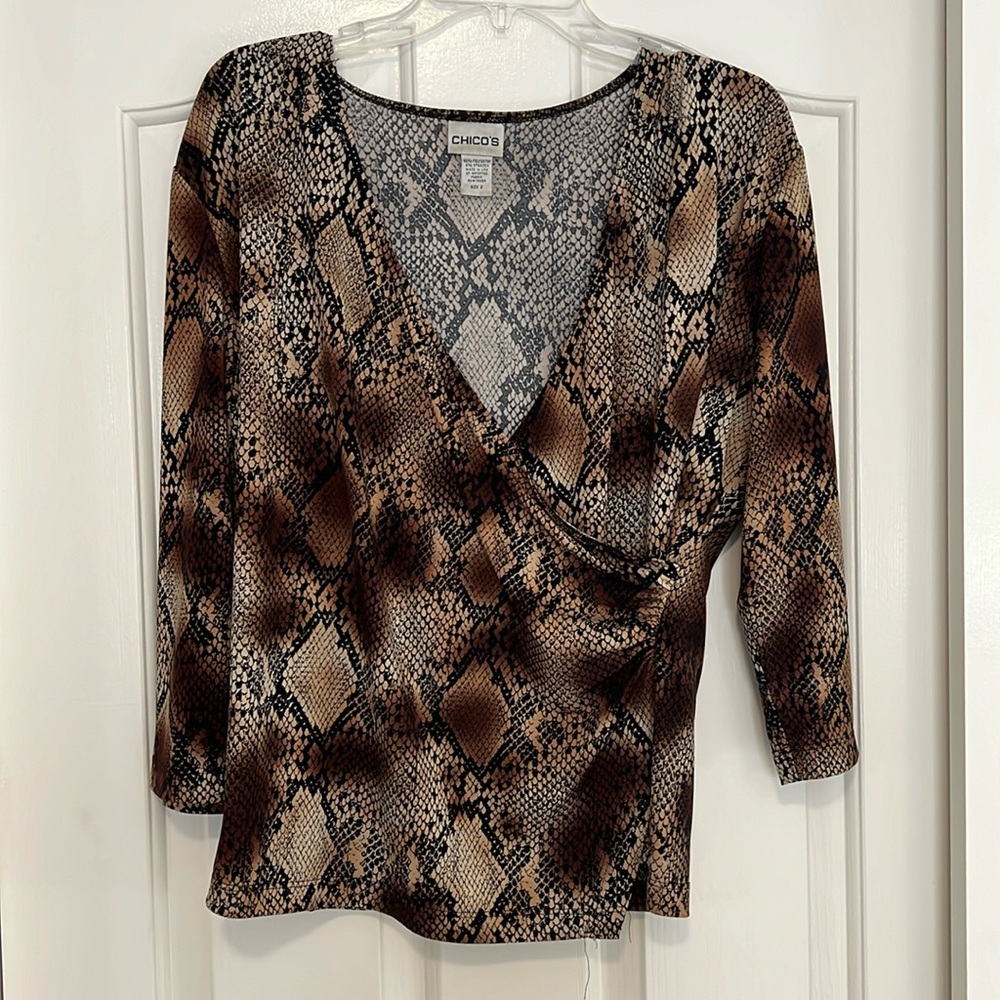 Chico’s faux front wrap blouse in an animal print. Size 2( misses 10/12).